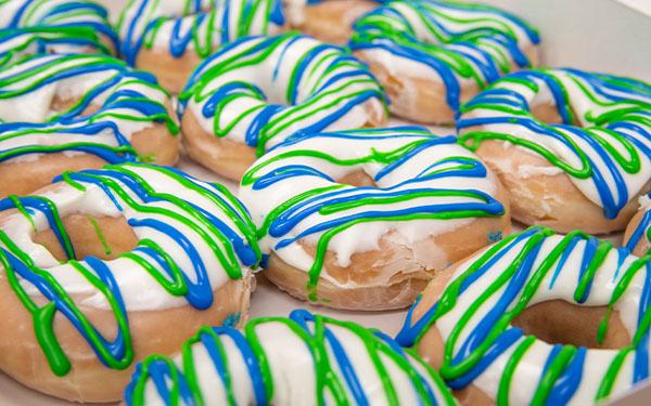 A picture of blue and green glazed donuts